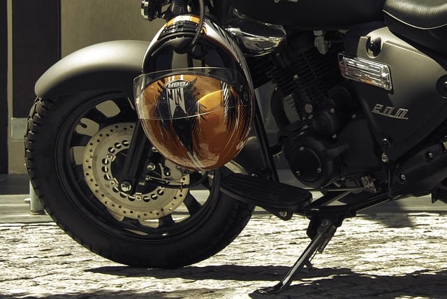 orange helmet hanging on a bike