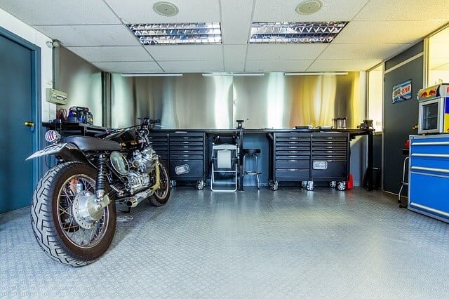 motorcycle getting parked in garage